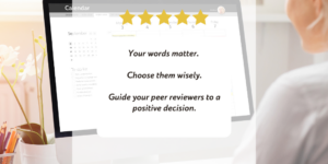 Woman sitting at a desk working at a computer screen.